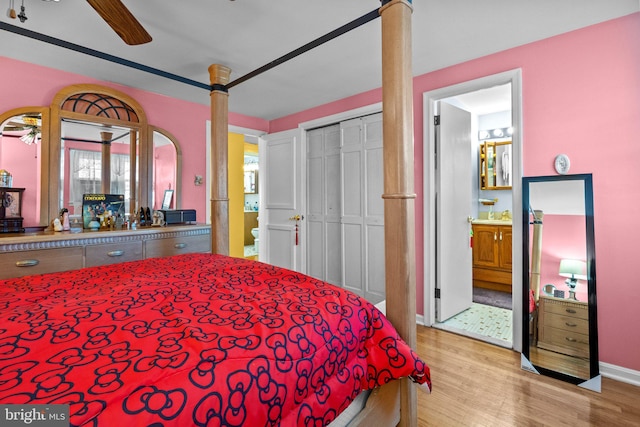 bedroom featuring ensuite bathroom, light hardwood / wood-style floors, and ceiling fan