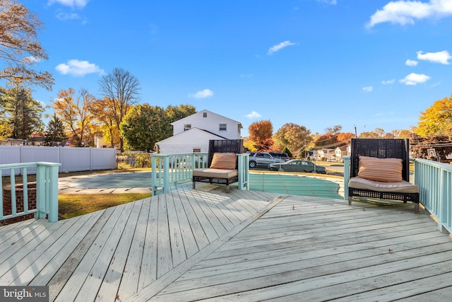 wooden terrace featuring a patio area