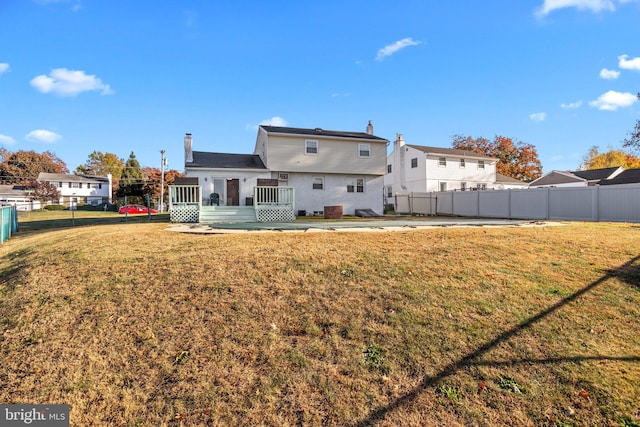 rear view of house with a yard and a patio