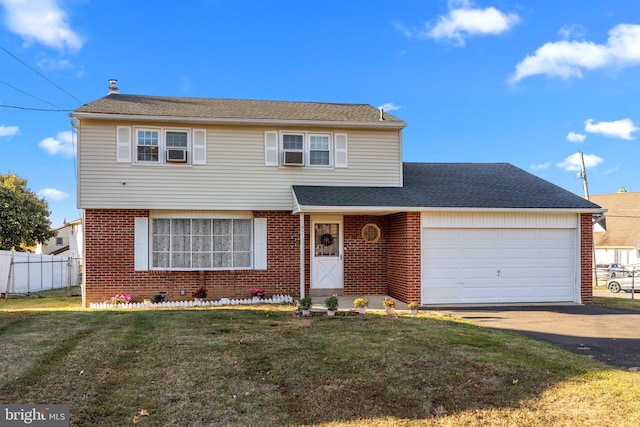 view of front property with cooling unit, a front lawn, and a garage