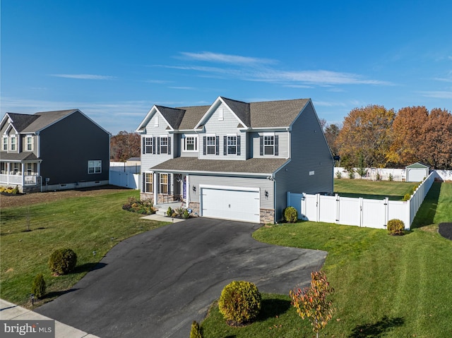 view of front facade featuring a front lawn and a garage