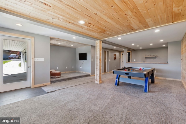 recreation room featuring carpet floors and wooden ceiling