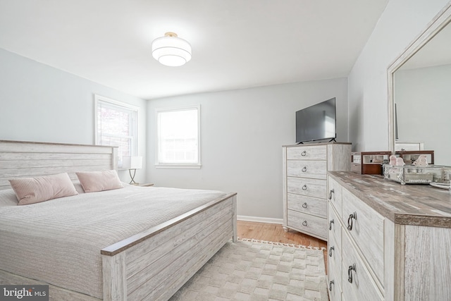 bedroom with light hardwood / wood-style flooring