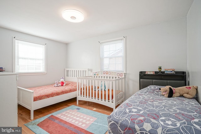 bedroom with wood-type flooring