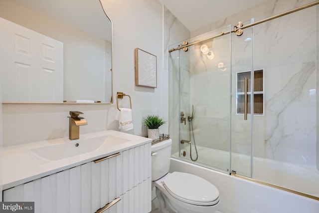 full bathroom with vanity, combined bath / shower with glass door, and toilet