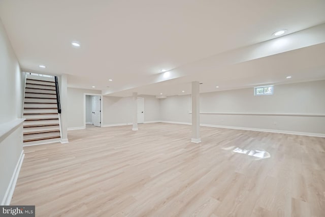 basement featuring light hardwood / wood-style flooring