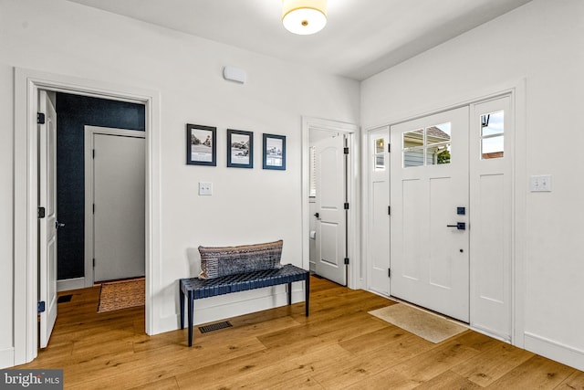 foyer with light hardwood / wood-style floors