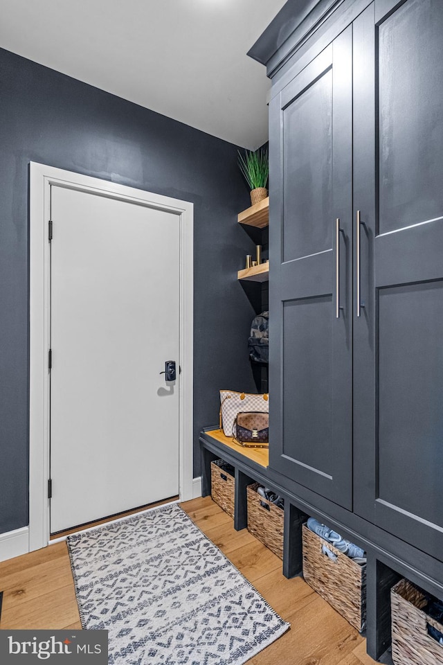 mudroom with light hardwood / wood-style floors