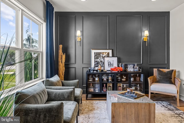 sitting room featuring light hardwood / wood-style flooring