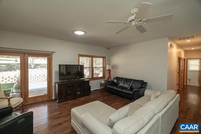 living room featuring dark hardwood / wood-style floors and ceiling fan