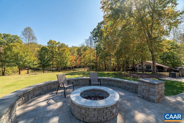 view of patio with an outdoor fire pit