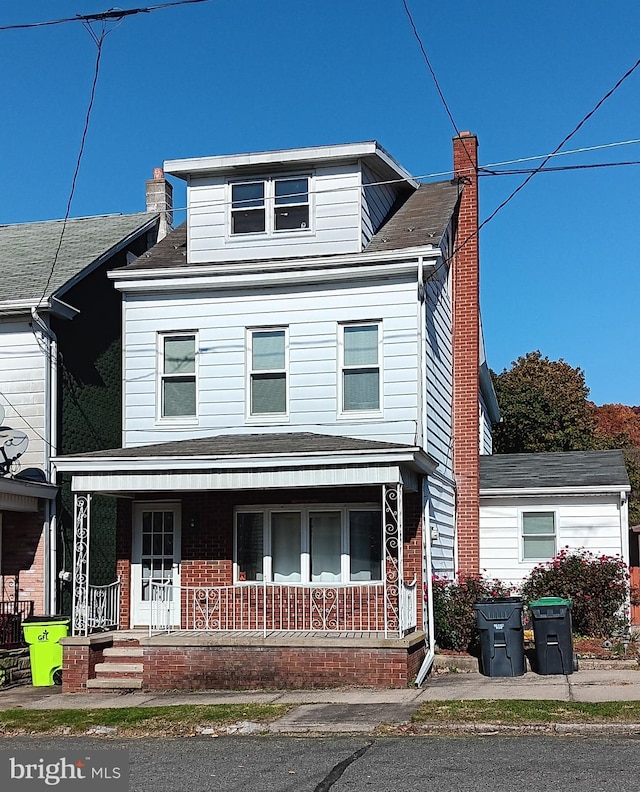 view of property with covered porch