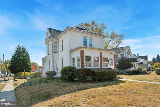 view of property exterior with a lawn