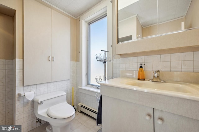 bathroom featuring toilet, a baseboard radiator, plenty of natural light, tile walls, and vanity