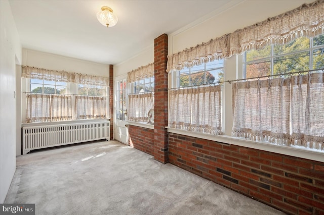 unfurnished sunroom with radiator