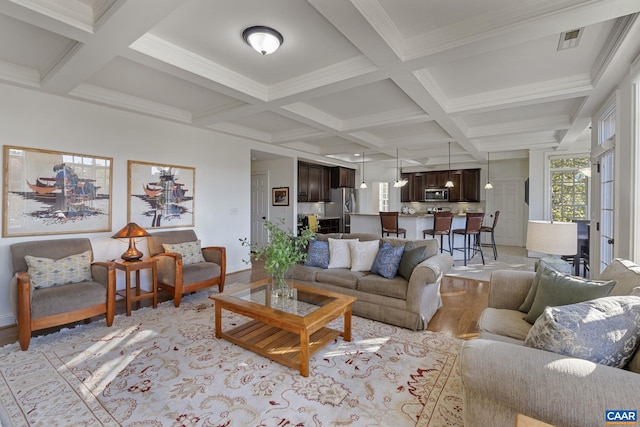 living room featuring coffered ceiling, beamed ceiling, and ornamental molding