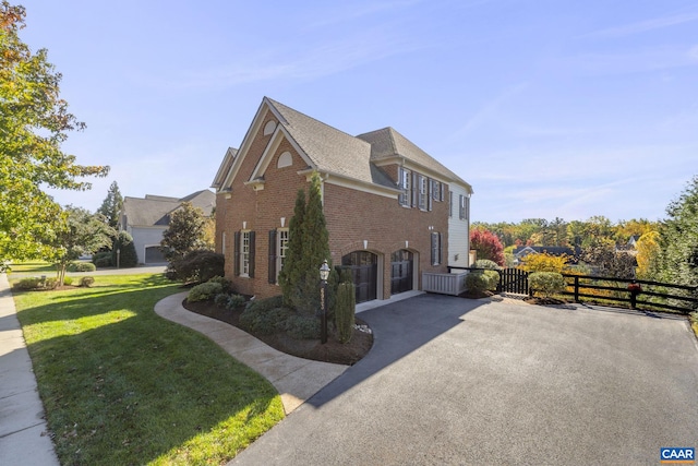 view of side of property with a yard