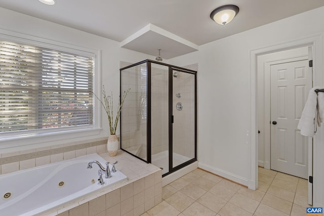 bathroom with independent shower and bath and tile patterned flooring