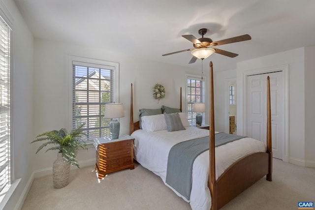 carpeted bedroom with ceiling fan