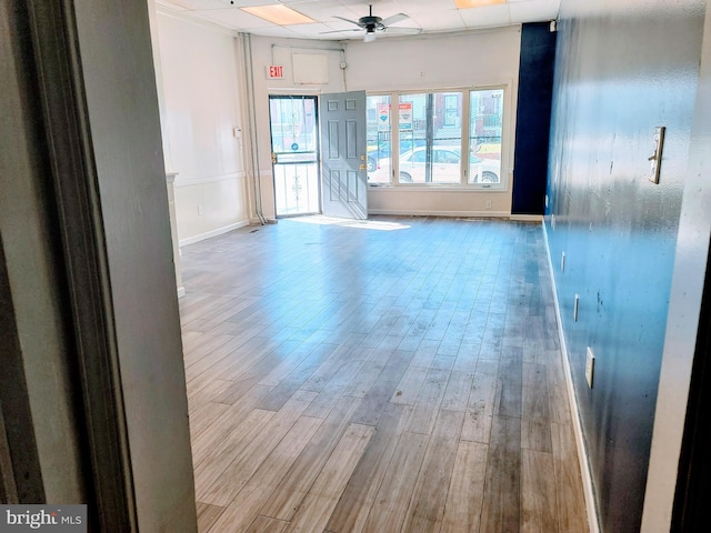 spare room featuring ceiling fan and light wood-type flooring