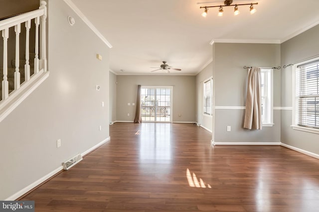 interior space with dark hardwood / wood-style flooring, ceiling fan, and crown molding