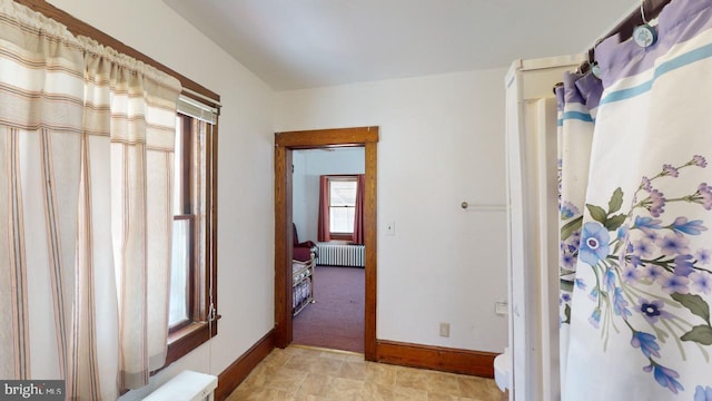 bathroom featuring toilet and radiator heating unit