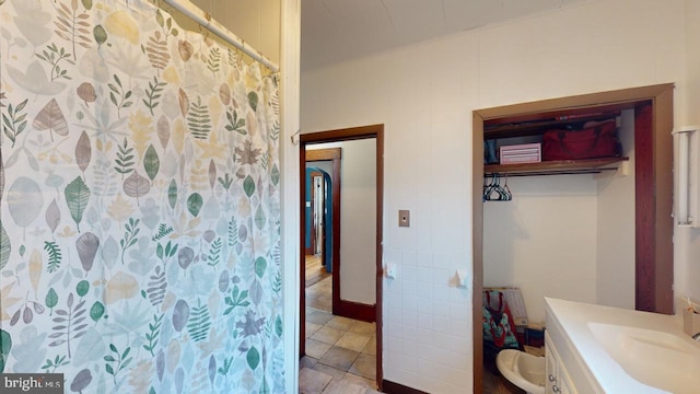 bathroom with vanity, toilet, tile patterned floors, and a shower with shower curtain