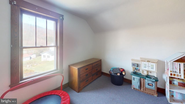 rec room featuring light carpet, vaulted ceiling, and plenty of natural light