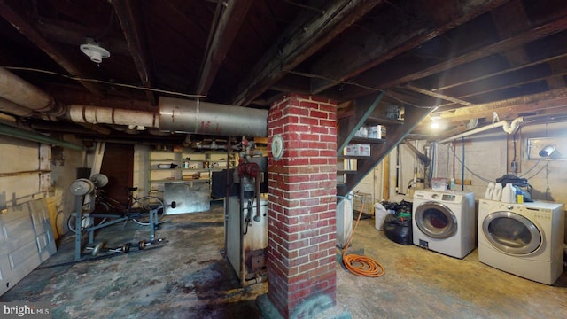 basement featuring washing machine and clothes dryer