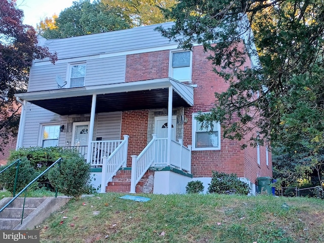 view of property featuring a porch