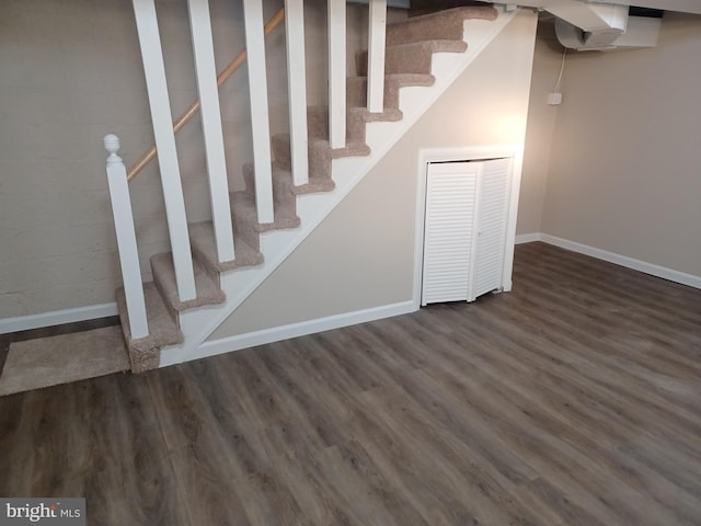 stairway with hardwood / wood-style floors