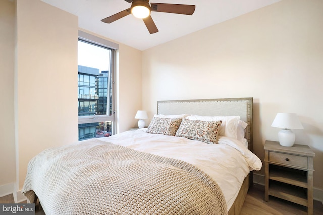 bedroom featuring hardwood / wood-style flooring and ceiling fan