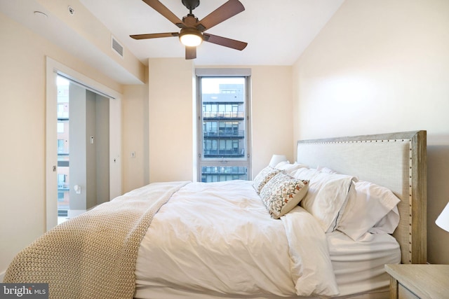 bedroom featuring lofted ceiling and ceiling fan