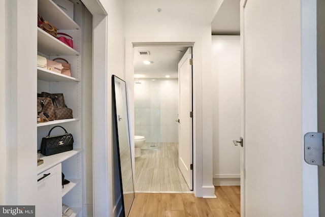 hallway featuring light hardwood / wood-style flooring