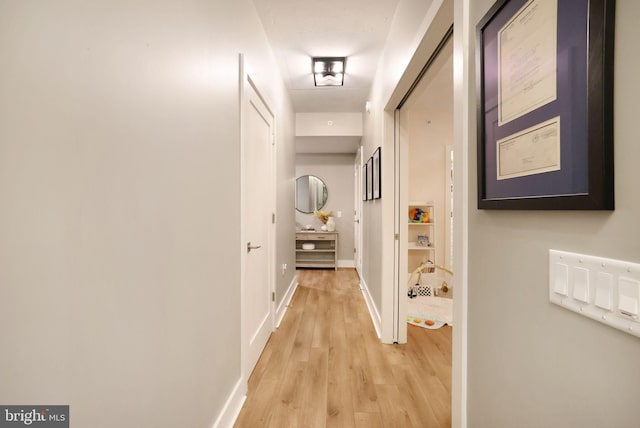 corridor with light wood-type flooring