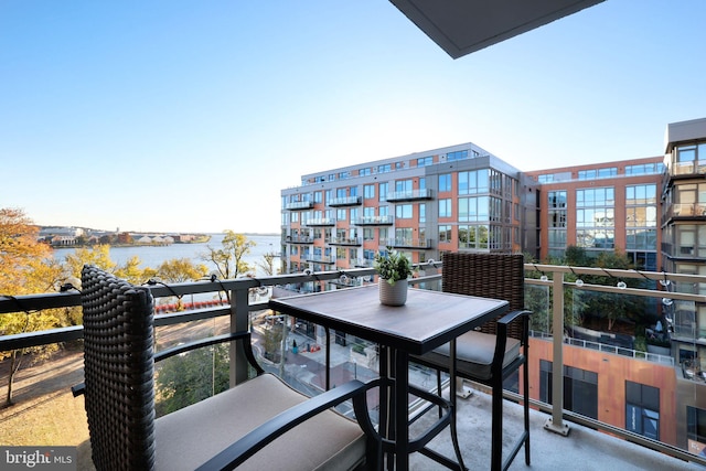 balcony featuring a water view