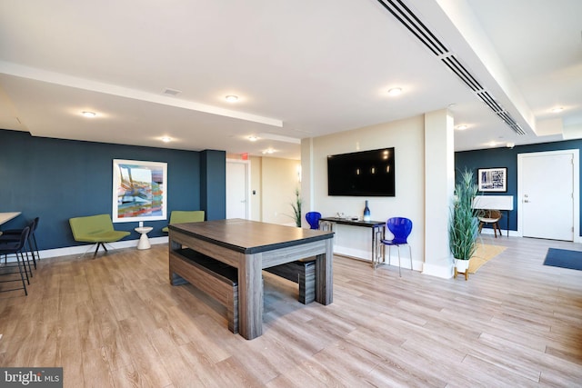 recreation room with light hardwood / wood-style floors