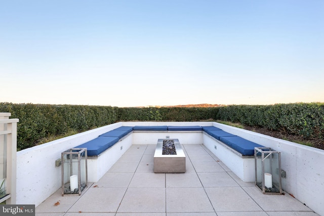 view of pool with an outdoor fire pit and a patio