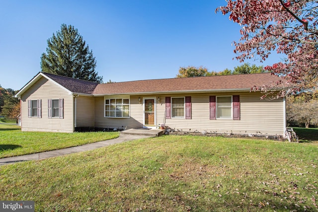 ranch-style home with a front yard