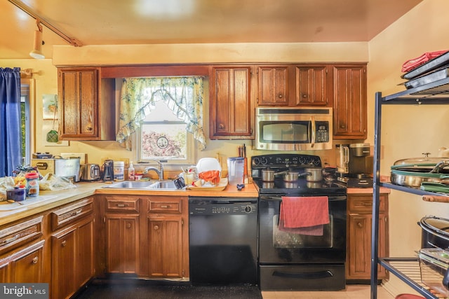 kitchen featuring black appliances and sink