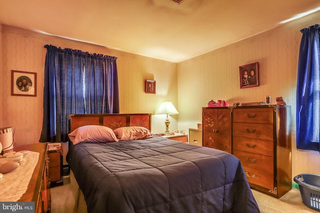 bedroom with light carpet