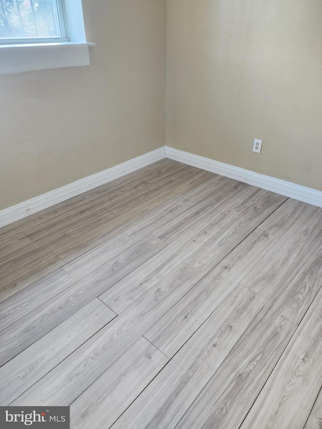 unfurnished room featuring light hardwood / wood-style floors