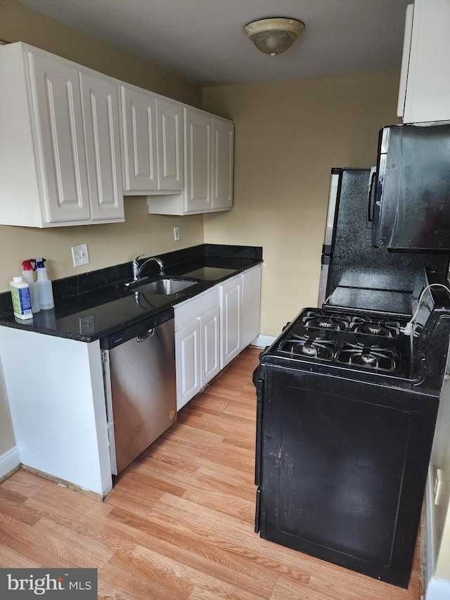 kitchen featuring black appliances, sink, light wood-type flooring, and white cabinets