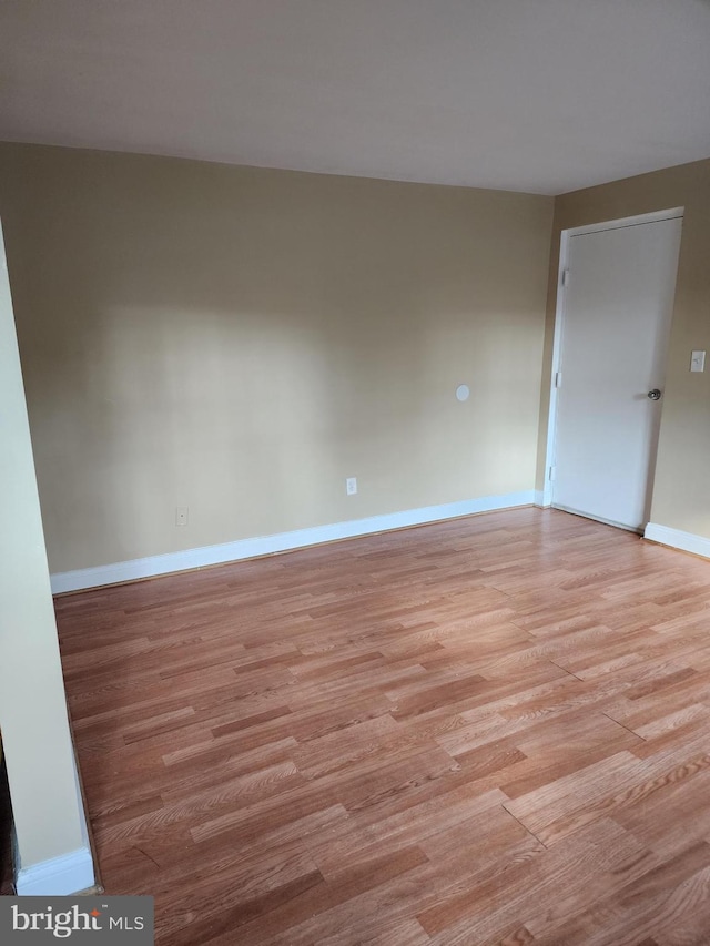 unfurnished room with light hardwood / wood-style floors