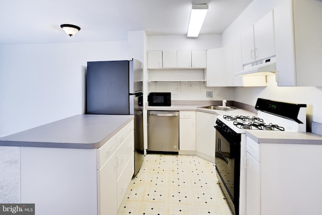 kitchen featuring white cabinetry, stainless steel appliances, and sink