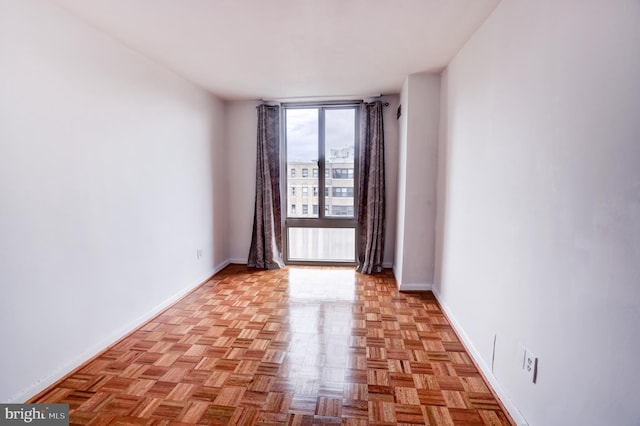 empty room with light parquet flooring