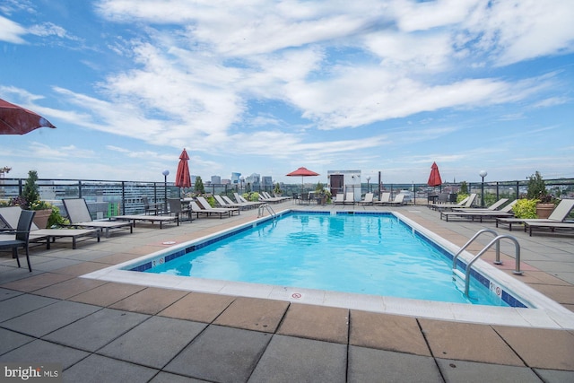 view of pool featuring a patio