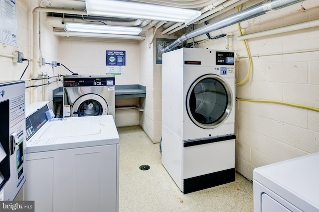 clothes washing area featuring washing machine and clothes dryer