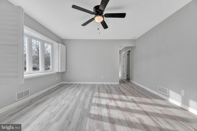 unfurnished room with light hardwood / wood-style floors and ceiling fan