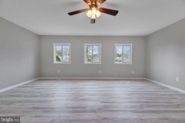 unfurnished room featuring ceiling fan and light wood-type flooring